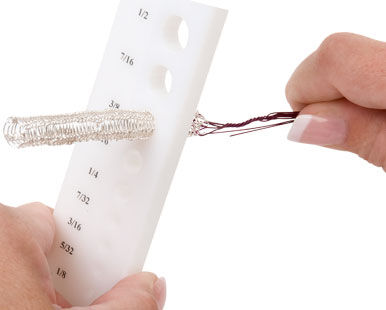 Putting wires through the draw plate